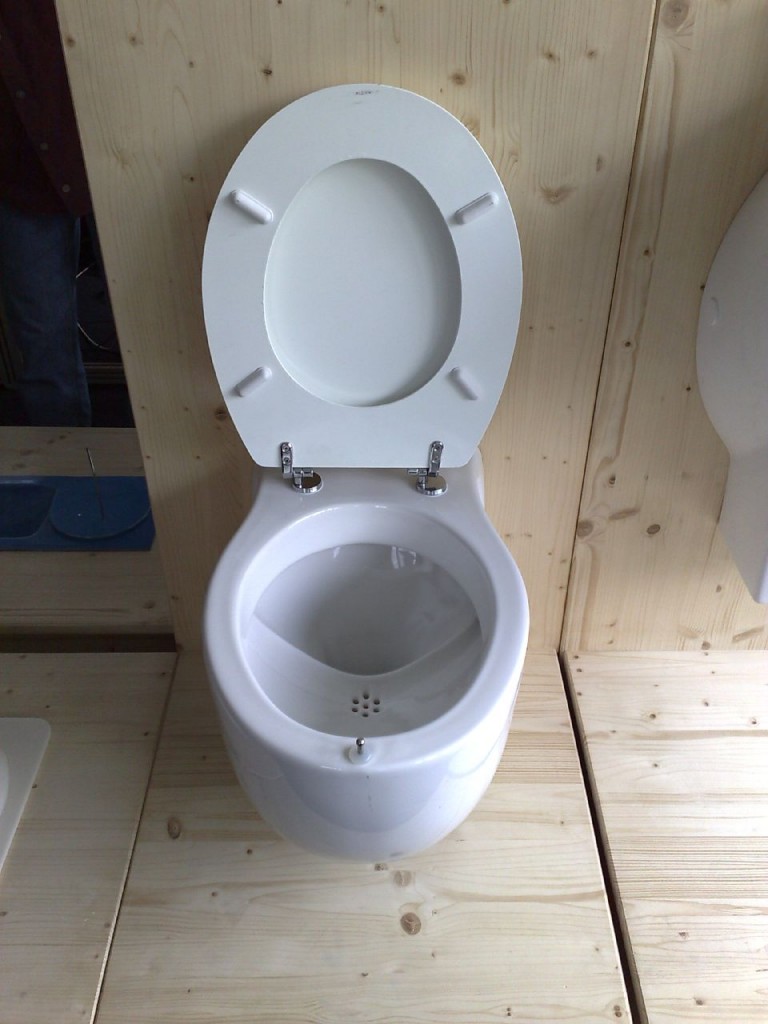 This NoMix toilet looks like a man could aim right into the urinal portion without too much trouble. Unfortunately, this particular model has a weight-activated valve, so you still have to sit. A problem that doesn't have to be a problem, methinks. Photo by Flickr user kikuyumoja.