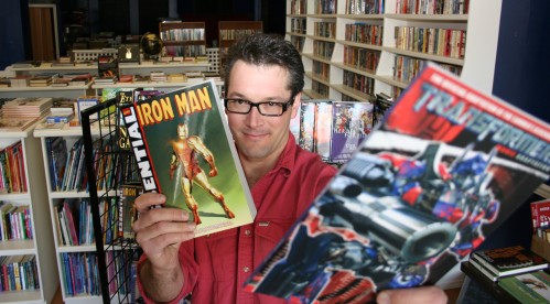 Photo of T. Keith, with the two graphic novels he'll be handing out on Saturday, by Grant, but courtesy the Brandon Sun.